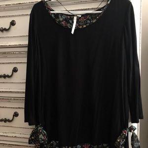 Woman’s black blouse with floral pattern